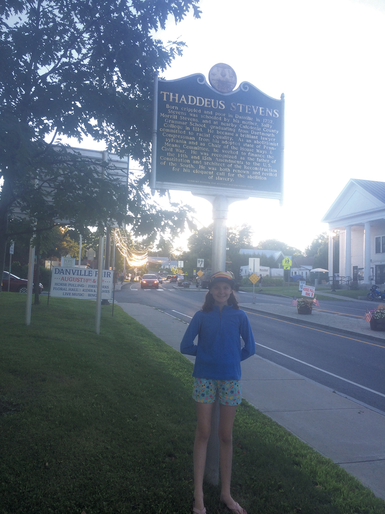 Somerset Pierce in front of the historical marker commemorating the birthplace of abolitionist Thaddeus Stevens